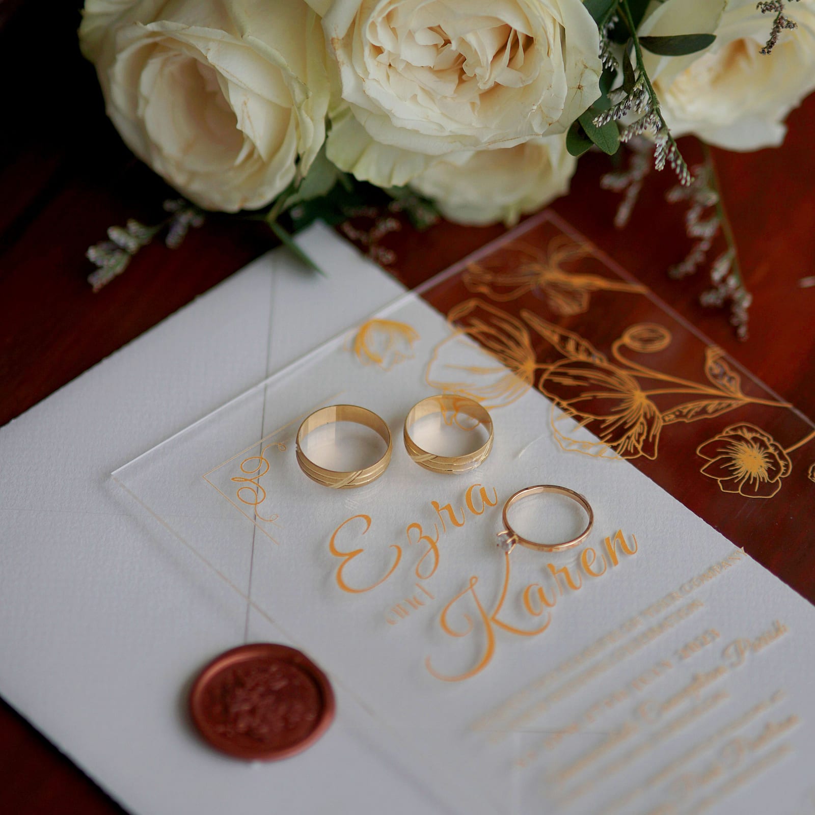 Wedding invitation card with rings and roses